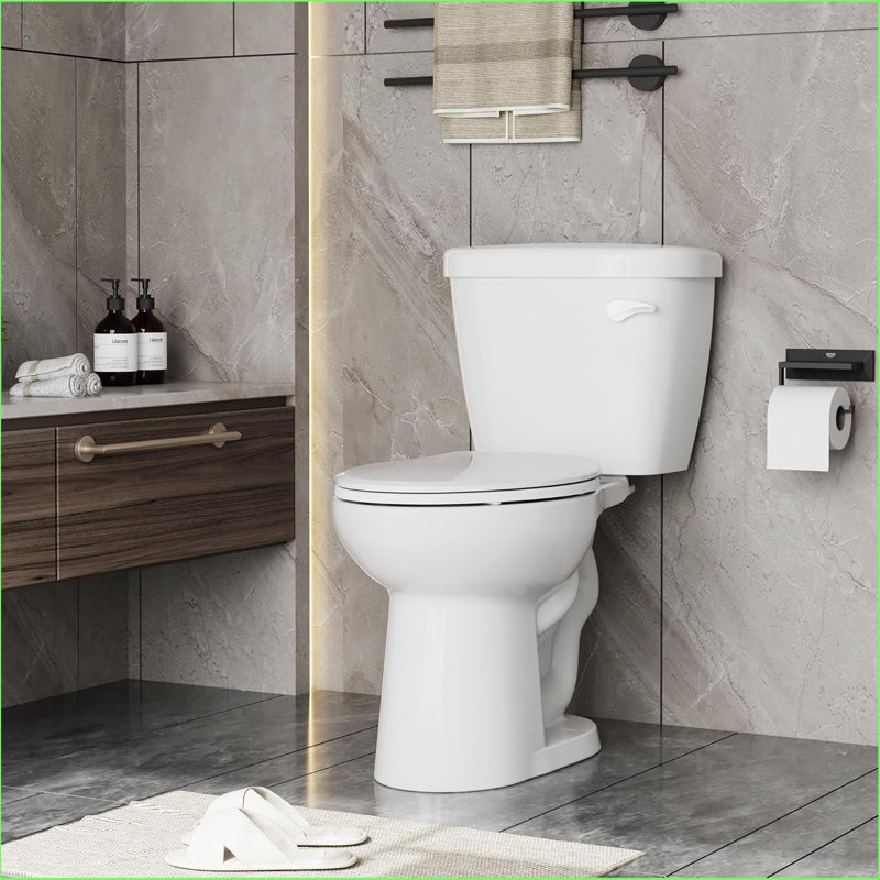 Toilette allongée deux pièces à hauteur Ada | Chasse d'eau avec siège à fermeture en douceur 1,28 Gpf | 17 po de hauteur confortable, bol en céramique durable et cuve brute de 12 po | Installation facile, blanc