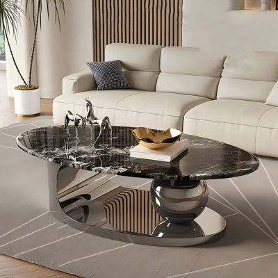 Table basse ovale minimaliste en acier inoxydable avec plateau en pierre noire super-cristallisée
