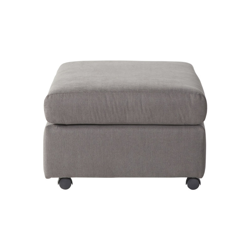 Fauteuil moderne moelleux dans des tons gris, somptueux tissu de salon foncé