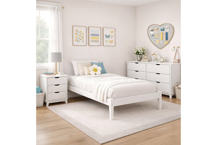 children’s bedroom with white bedroom set including a twin bed, dresser, and nightstand