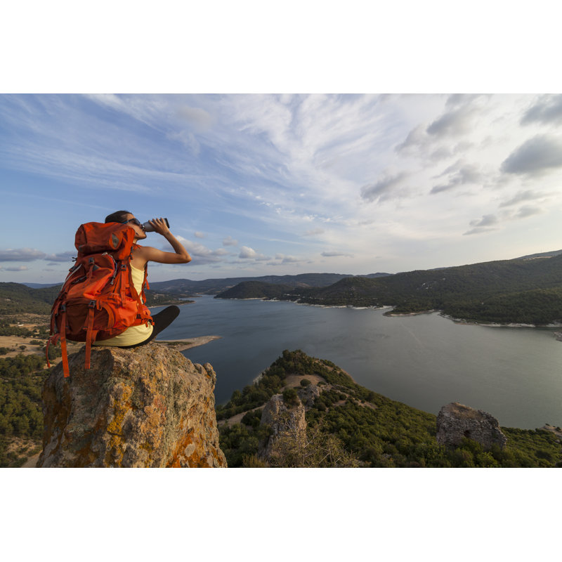 Female Hiker Drinking Water On The Top Of A Rock by Guvendemir - No Frame Art Prints on Canvas, 81cm H x 122cm W