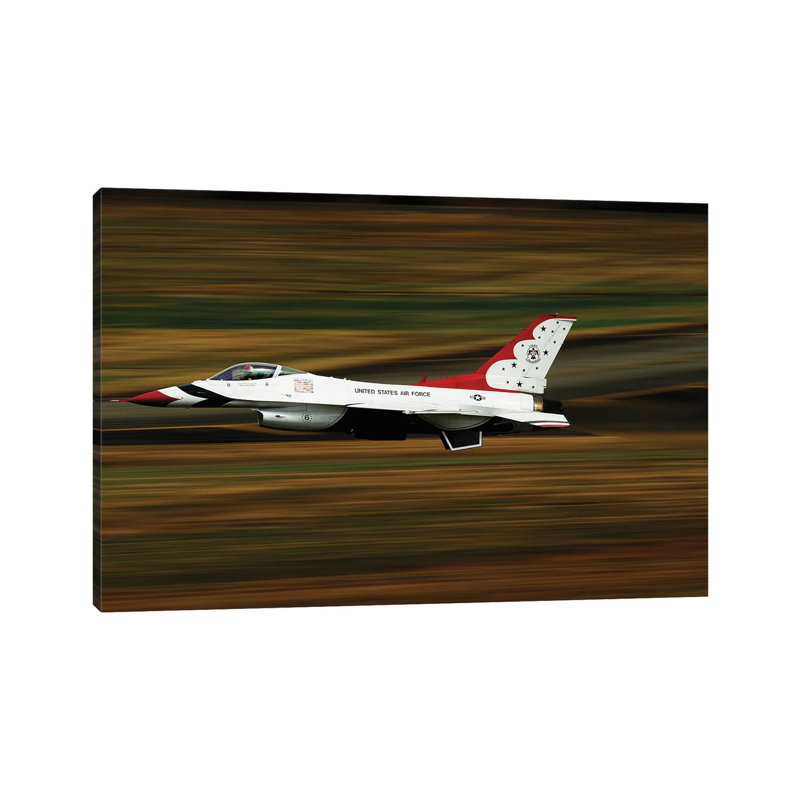 An F-16 Thunderbird Of The US Air Force Flying At High Speed by Stocktrek Images - Wrapped Canvas Print