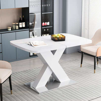 Table de salle à manger carrée d'apparence moderne, blanche avec base en acier, extensible, capacité de charge de 220 lb, avec roulement