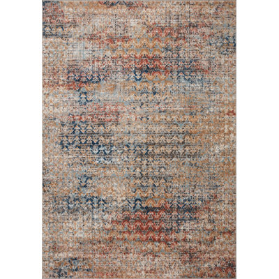 Tapis en polypropylène à motif de chevrons orange / bleu Mainville