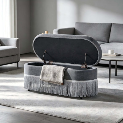Oval Upholstered Storage Ottoman with Fringe Trim & Lift-Top Lid - 39"L x 16"W x 17"H, Multi-Functional Footrest & Hidden Storage for Living Room or Bedroom - Beige Fabric with Metal Frame