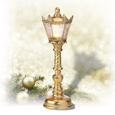 Lampe à pile dorée ornée