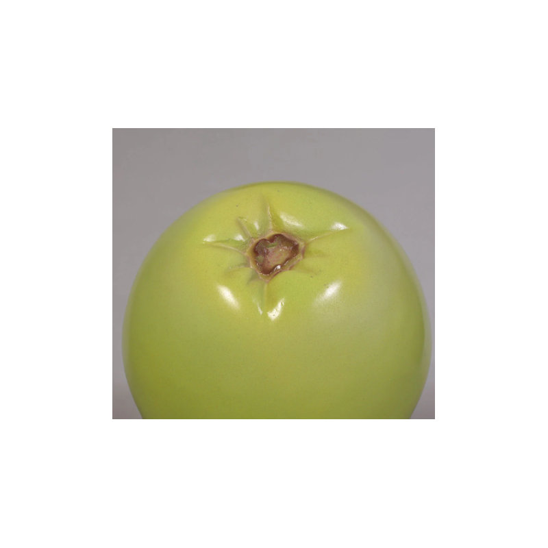 Petite statue de poire verte surdimensionnée