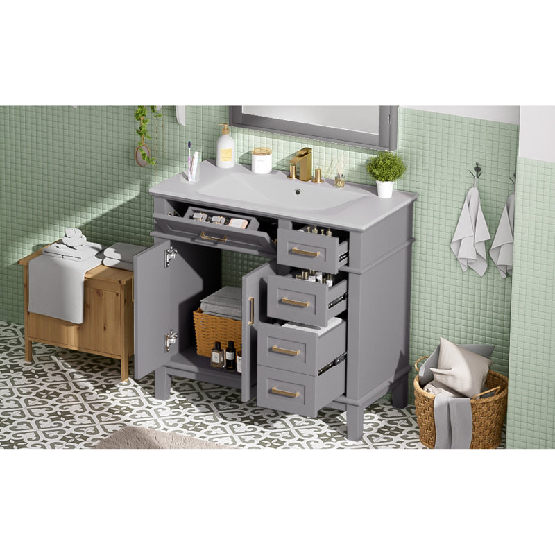 De salle de bain moderne gris avec portes à fermeture en douceur et lavabo en céramique, solution de rangement compacte pour les petites salles de bain