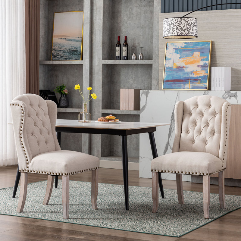 Chaise de salle à manger à garniture cloutée et capitonnée Jolynn, Beige, Bois