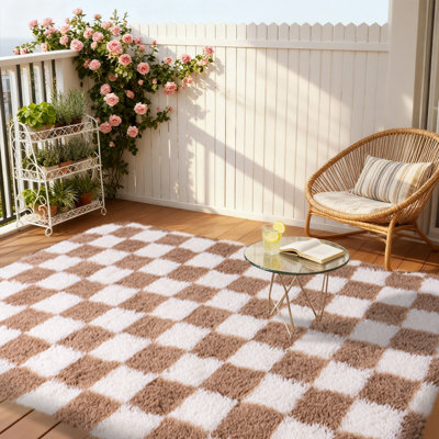 Beige and camel-colored checkered area rug, slip-resistant, durable, and soft, ideal for nurseries, playrooms, and living rooms.