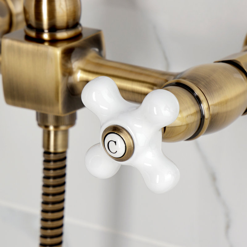 Kingston Brass Heritage Double-Handle 3-Hole Wall-Mount Bridge Kitchen Faucet with Brass Sprayer, Antique Brass