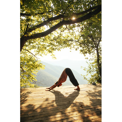 Doing yoga by the beautiful view 491275984