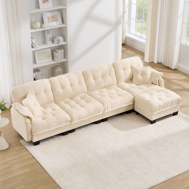 Canapé d'angle Chenille Cloud avec pouf amovible et finitions à pompons