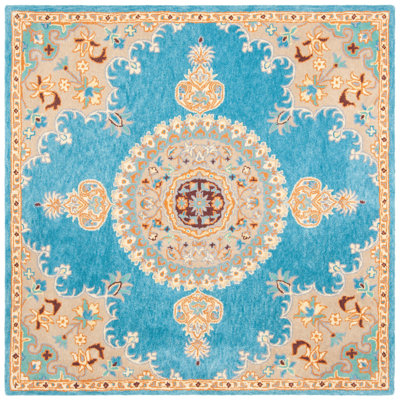 Clavene Hand Tufted Wool/Cotton Oriental Rug in Yellow/Blue