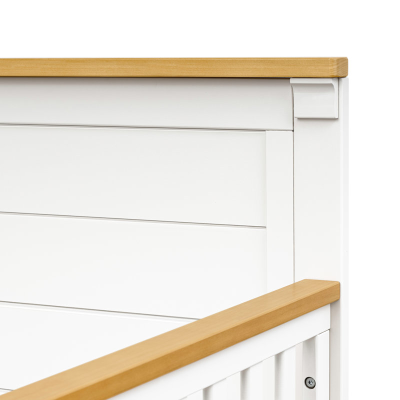 Warm White and Honey 4-in-1 Convertible Crib with Wood Paneling