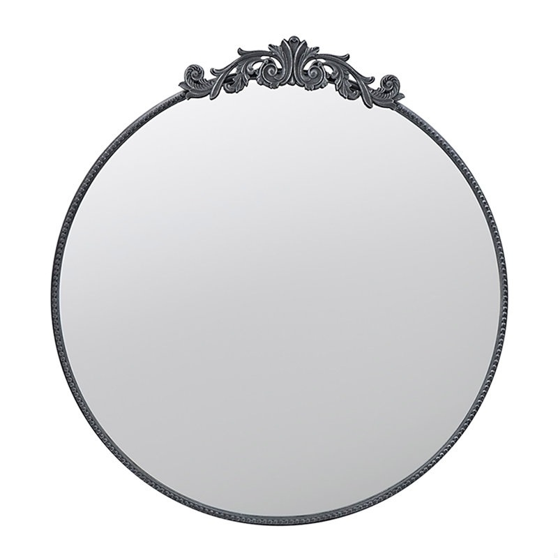 Miroir avec forme ronde et cadre d'inspiration baroque