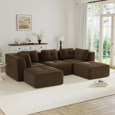 Canapé modulaire moderne avec assise profonde, repose-pieds mobiles, revêtement en velours côtelé capitonné, conception sans assemblage et base antidérapante pour le confort et la flexibilité du salon.