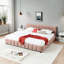 Très grand lit tapissier rose avec tête de lit et tiroirs de rangement pour une chambre à coucher détendue