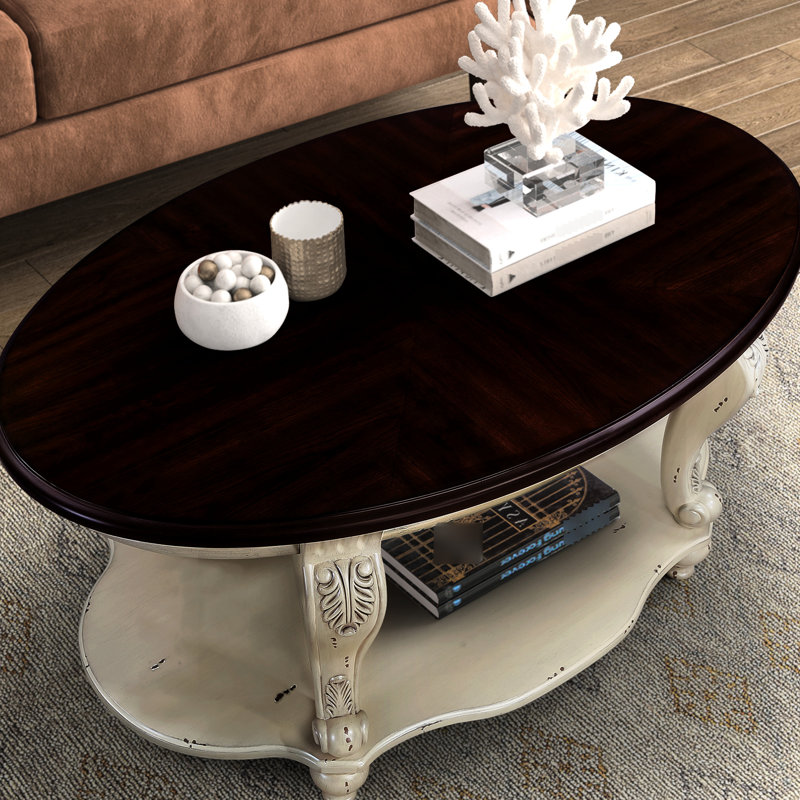 Table basse ovale en bois massif de 107 cm (42 po), pour embellir votre salon, 2 étagères, beige et pailleté, montage facile recommandé, finition brillante, sans effort.