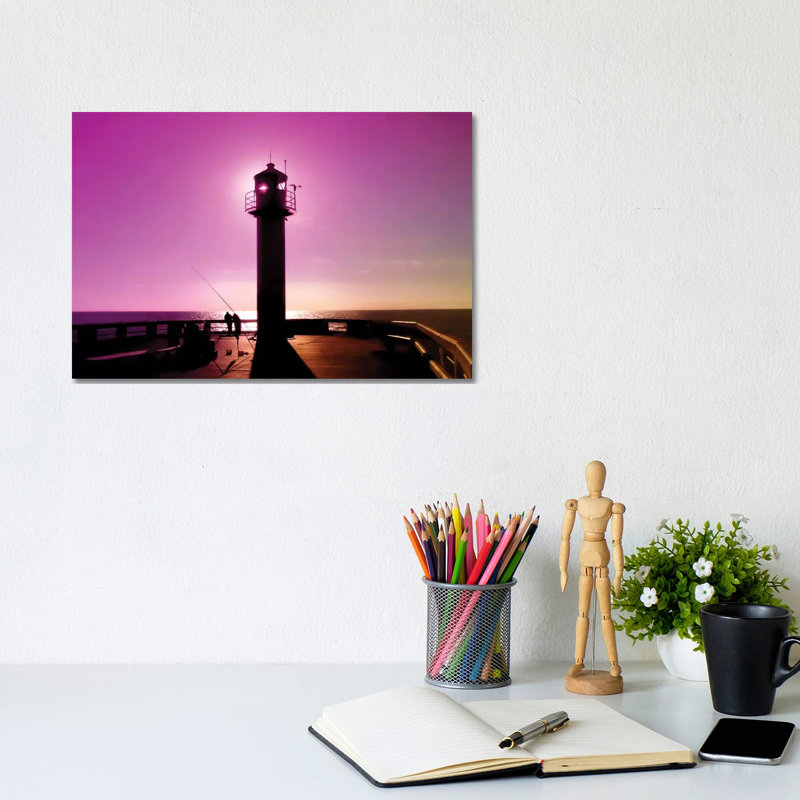 Romance At Sunset Under Sea Lighthouse by Beli - Wrapped Canvas Print, 20.32 cm H x 30.48 cm W