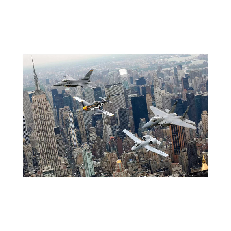 A P-51 Mustang, F-16 Fighting Falcon, F-15 Eagle, And A-10 Thunderbolt II Fly Over New York City by Stocktrek Images - Wrapped Canvas Print