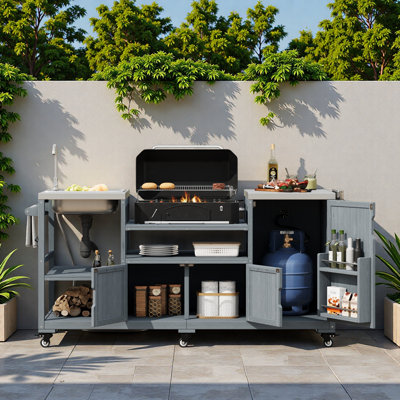 Îlot de cuisine extérieur avec évier, plateau en acier inoxydable, armoires de rangement et supports de rangement internes