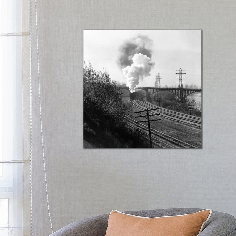 1940S Aerial Of Train Traveling Along River Under Bridge Billowing Smoke Near Columbus Ohio - Wrapped Canvas Print