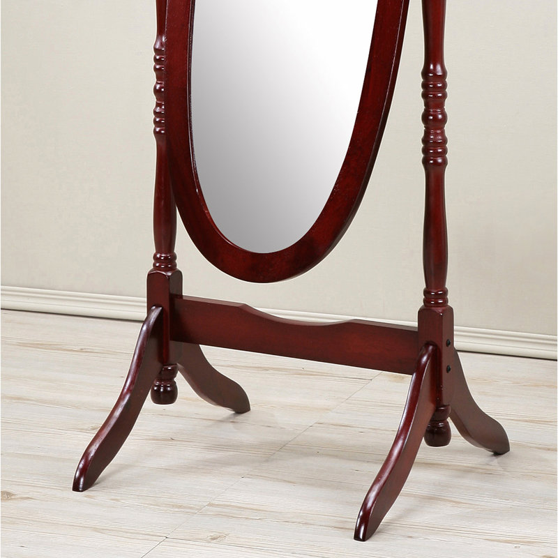 Miroir sur pied traditionnel au fini cerisier. Inclinable, reflet du corps, construction autoportante stable. 22,5 cm (l) x 16 cm (p) x 58,04 cm (h). Miroir décoratif couleur cerisier. Verre ovale. Stable.