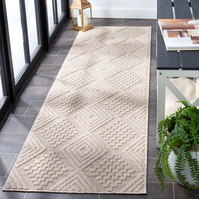 Tapis géométrique tissé à la machine en polypropylène crème / ivoire Deveah