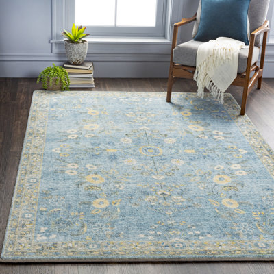 Tapis bleu à motif floral Berger