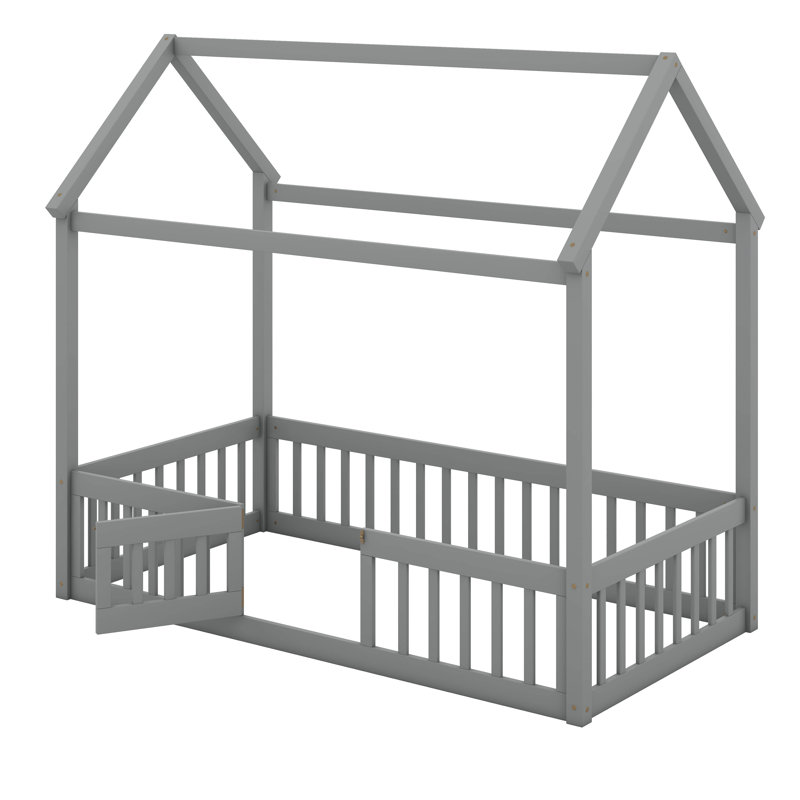 Lit simple en bois avec clôture et porte