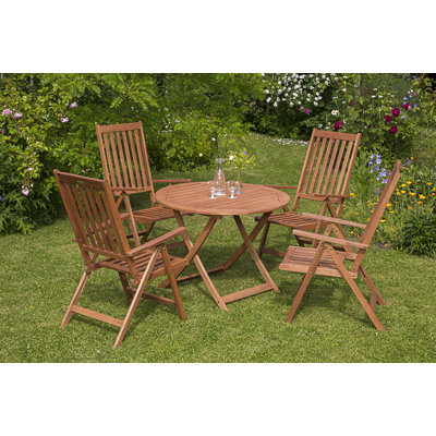 Aarini 4 - Person Wood Patio Dining Set with Round Table