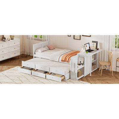 Lit plateforme simple en bois multifonctionnel avec bureau et tablette de rangement au bout du lit, lit gigogne intégré et 3 tiroirs