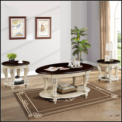 Ensemble de table basse de salon avec finition lisse, courbes élégantes et tablettes inférieures pour le rangement, idéal pour les intérieurs modernes et traditionnels.