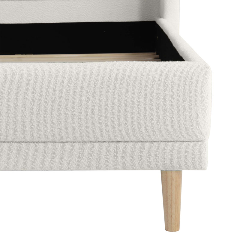 Lit plateforme tapissier avec tissu Boucle et tête de lit à oreilles, idéal pour créer une ambiance de chambre à coucher relaxante et élégante