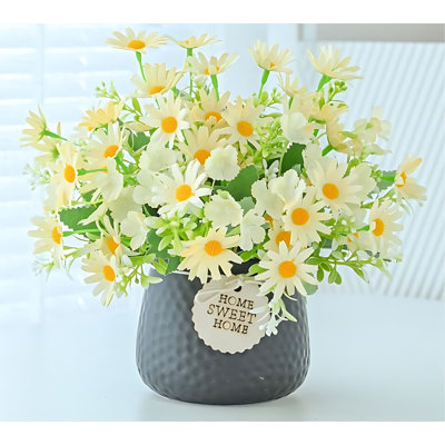 Centre de table en fleurs artificielles