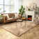 Blakes Solid Color Handmade Faux Sheepskin Area Rug in Beige