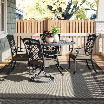 Wildermuth 4 - Person Patio Dining Set Umbrella Hole Included Round Table with Sunbrella® Cushions Included