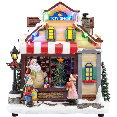 11.42"H Animated Toy Shop (Moving Tree) - LED Lights, 8 Carols Music, Adapter - Hand-Painted Resin