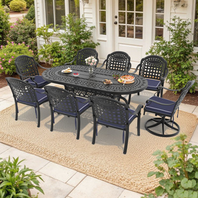 Ensemble de salle à manger ovale de patio 9 pièces (81,89 po L) avec trou pour parasol, 2 chaises pivotantes et 6 chaises empilables avec coussins bleus