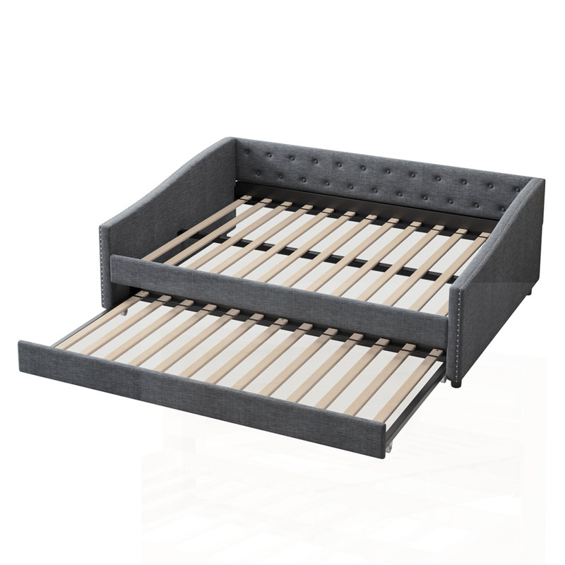 Élégant lit de jour avec lit gigogne et rangement, combinant des sièges confortables et un espace de couchage supplémentaire pour les maisons modernes.