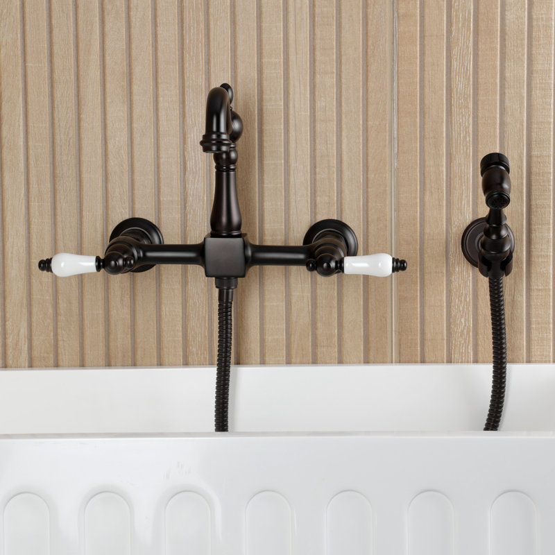 Kingston Brass Heritage Double-Handle 3-Hole Wall-Mount Bridge Kitchen Faucet With Brass Sprayer, Oil Rubbed Bronze
