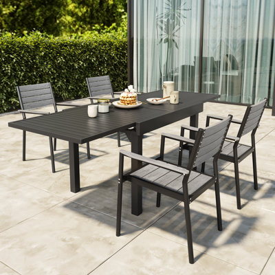 Loreyna Rectangular 4 - Person Outdoor Dining Set with Aluminum Frame and Armchairs