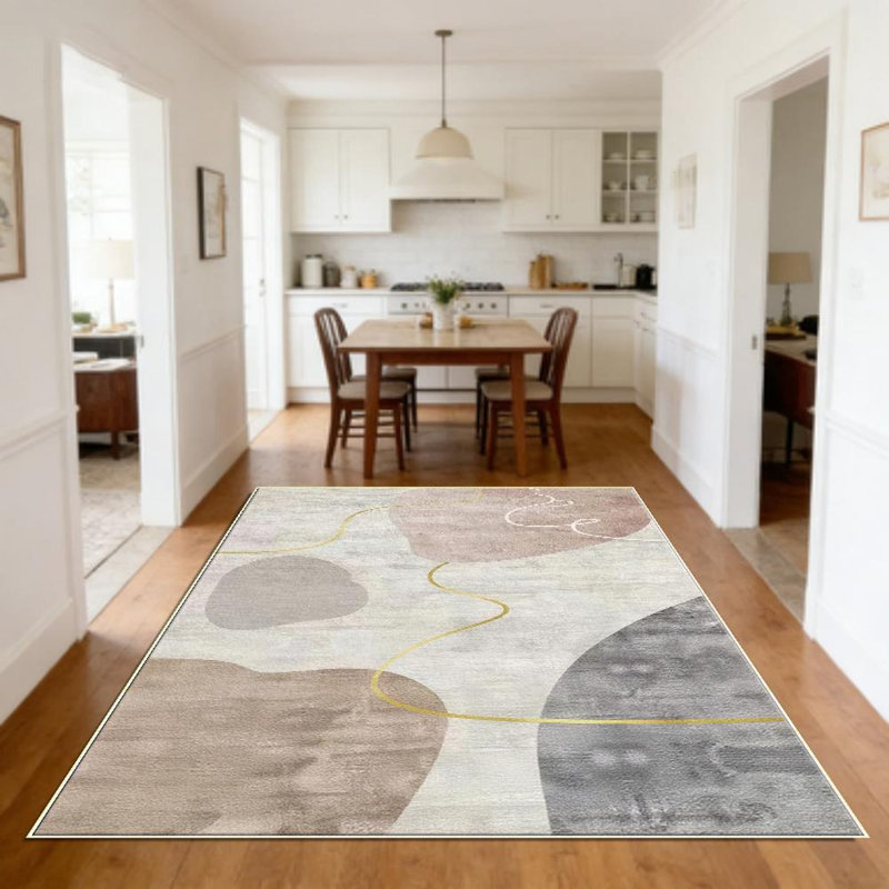 A tranquil, neutral-toned abstract wabi-sabi style living room rug with gold accents, soft and comfortable, easy to maintain, machine-washable indoor mat, suitable for dining room, bedroom, home office, entryway, kitchen, balcony, and home decor.