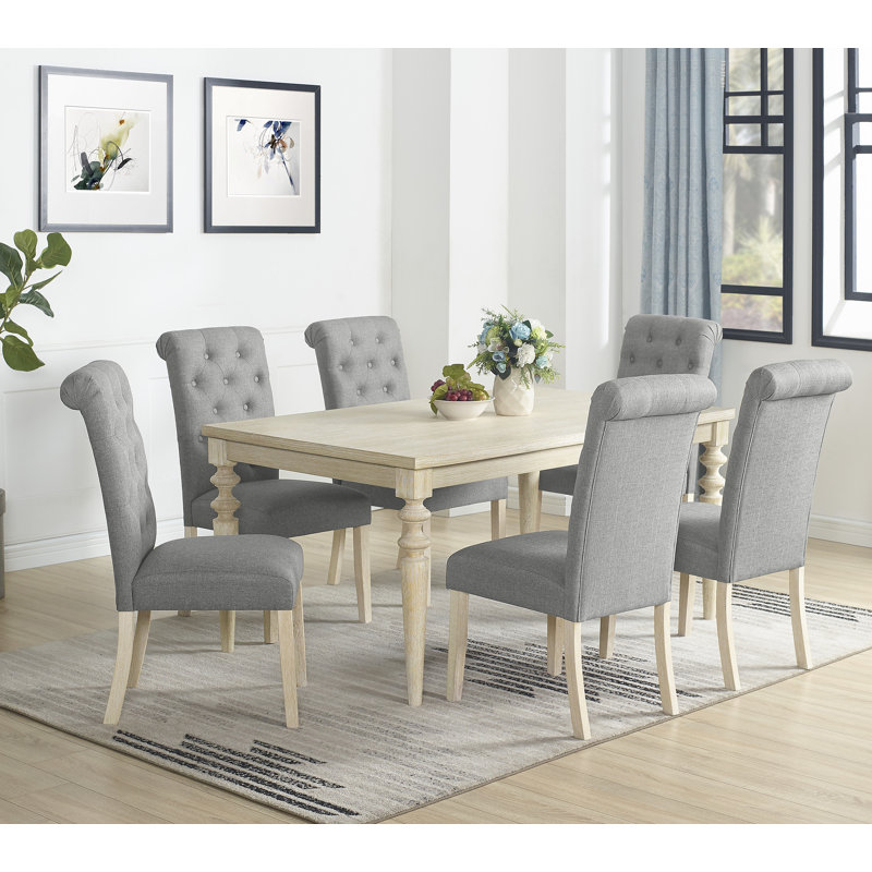 7-piece Dining Set Featuring a Turned-Leg Dining Table and 6 Tufted Chairs for a Stylish and Comfortable Dining Experience