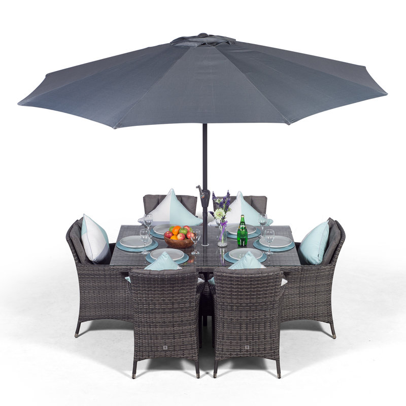 Karcher 6 - Person Wicker Patio Dining Set with Rectangular Table , Cushions Included