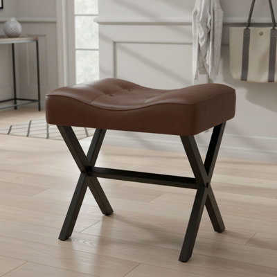 Fauteuil en cuir véritable en forme de selle, coussins épais, brun foncé, pieds robustes en forme de X en métal, repose-pieds polyvalent.