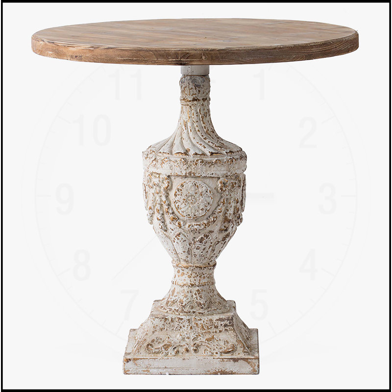 Table ronde exquise en bois antique avec détails floraux complexes et médaillon