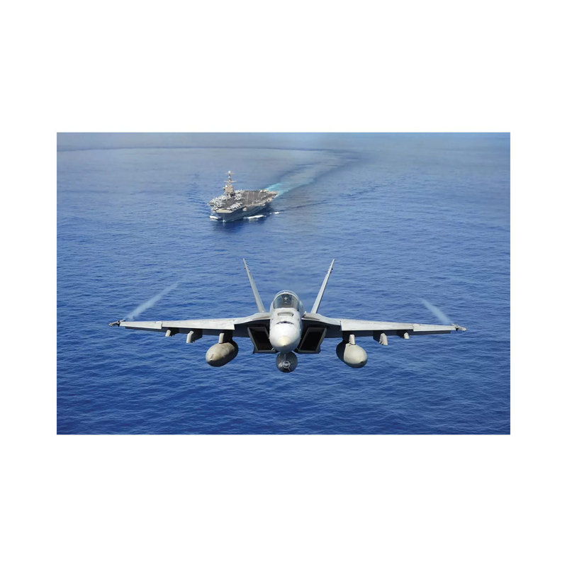 An F/A-18E Super Hornet Flying Above USS John C. Stennis by Stocktrek Images - Wrapped Canvas Print