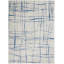 Tapis ivoire et bleu à motifs irréguliers-953538882